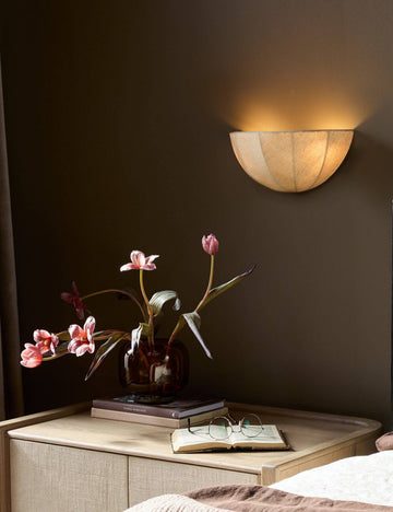 #color::cream | Mahan linen up-ight wall sconce hung above a nightstand