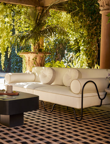#color::brown | Littu Indoor / Outdoor Striped Disc Pillow by Sarah Sherman Samuel in Brown styled on an outdoor sofa.
