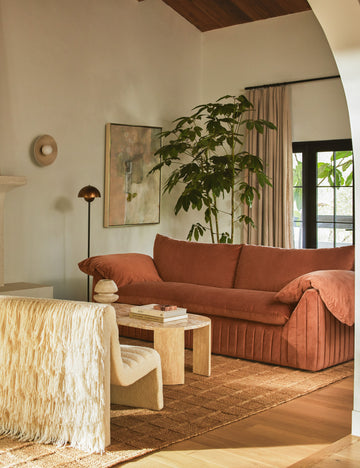 #showall::41974474571875 | Living room featuring the Yucca relaxed profile wide arm sofa by Carly Cushnie.