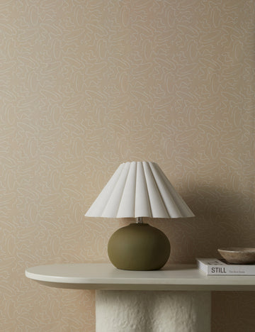 #color::natural | Topos Abstract Line Patterned Wallpaper by Élan Byrd on a wall behind a console table styled with a small table lamp.