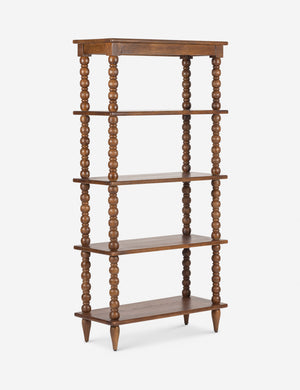 Angled view of the Foxton beaded turned wood tall bookcase