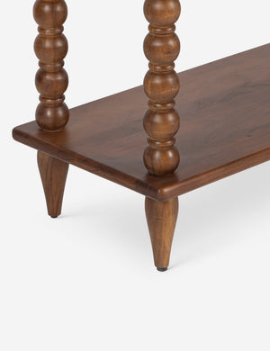 Close up of the bottom shelf of the Foxton beaded turned wood tall bookcase