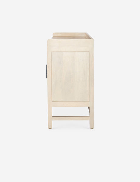 #color::natural | Side view of the Philene natural mango wood sideboard with cane doors