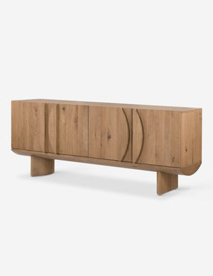 Angled view of the Remwald sculptural oak wood sideboard cabinet.