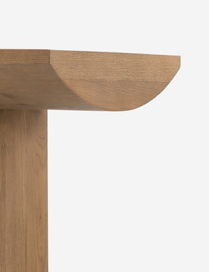 Close up of the leg of the Remwald sculptural oak wood console table.