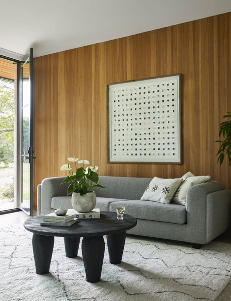#color::navy-and-white #size::48--x-48- | The see through navy and white wall art is hanging on a wood paneled wall in a living room above a gray sofa 