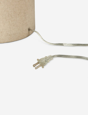 Close up of the cord of the Solstice monochromatic linen column floor lamp.