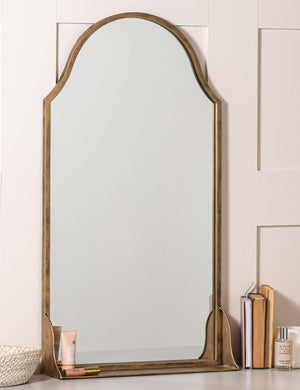 Clare arched wall mirror with shelf styled on top of a vanity table