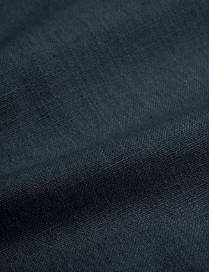 Detailed shot of the navy linen on the Adara navy linen upholstered bed.