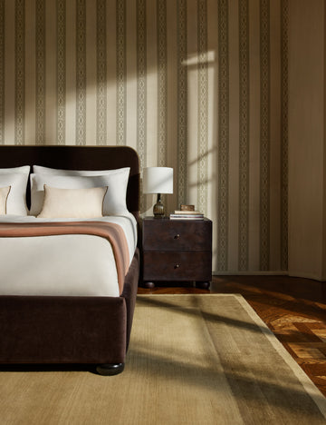#color::olive #size::6--x-9- #size::8--x-10- #size::9--x-12- #size::10--x-14- #size::12--x-15- | A bedroom featuring the Deller Hand-Loomed Wool Rug by Jake Arnold