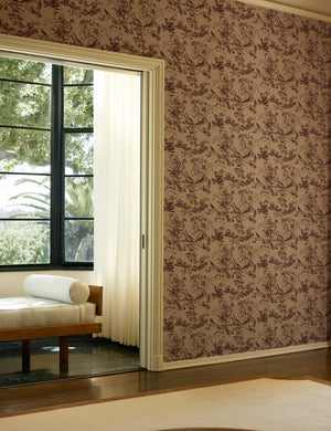 A room with a sitting nook with a bench featuring the Dors Grasscloth Wallpaper by Jake Arnold