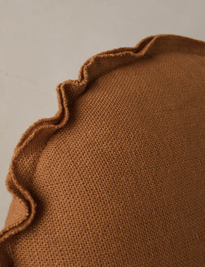 Close up of the Arlo linen flange trim round pillow.