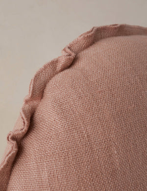 Close up of the Arlo linen flange trim round pillow.