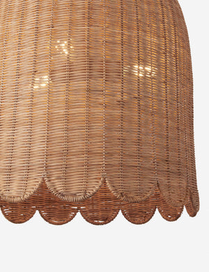 Close up of the Marzo scalloped shade woven rattan pendant light.