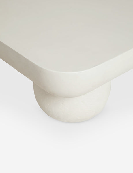 | The rounded corner and leg on the Clouded square white coffee table
