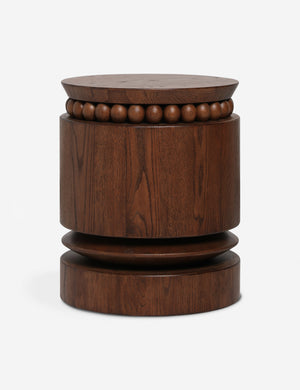 Coco round drum beaded wood side table by Carly Cushnie.