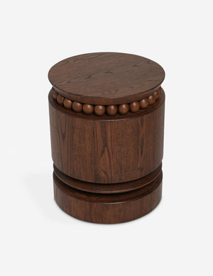 Coco round drum beaded wood side table by Carly Cushnie.