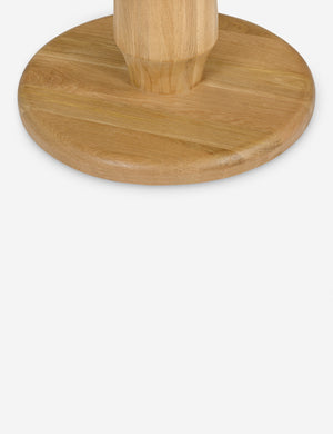 Close up of the base of the Tellier natural oak round counter-height table