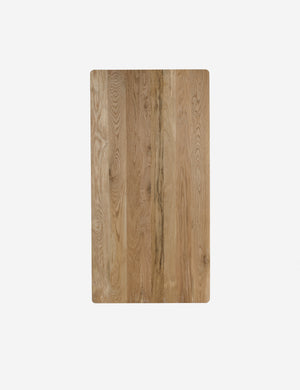 Overhead view of te Lussier natural oak tapered leg dining table