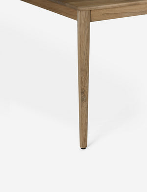 Close up of the leg of the Lussier natural oak tapered leg dining table
