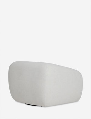 Angled rear view of the Harlowe softly sculpted plush swivel accent chair.