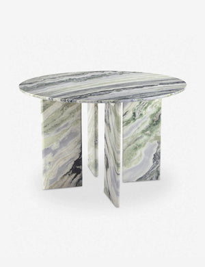 Angled view of the Celia sculptural round marble dining table.