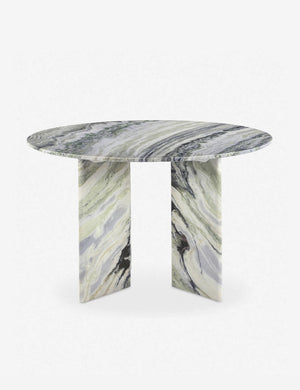 Celia sculptural round marble dining table.