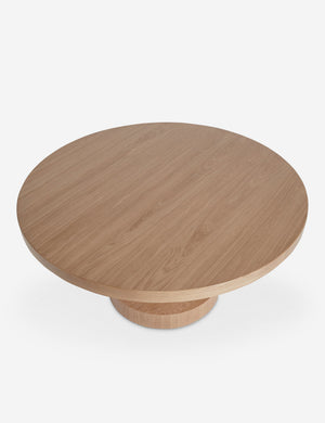 Overhead view of the Karine round natural wood pedestal dining table