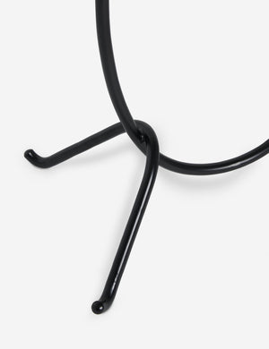 Close up view of the base of the Kukka modern two light wavy base floor lamp in bronze