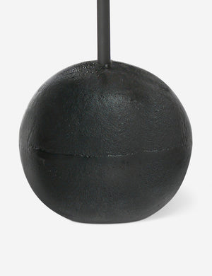 Close up of the base of the Olinda slim, spherical base round drink table