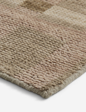 Close up of the corner of the Lalan hand-knotted geometric pattern wool rug.