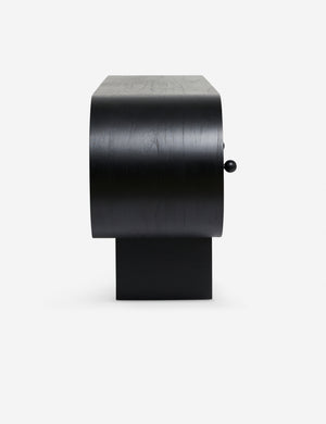 Side view of the Laughlin retro pill shaped sideboard cabinet in black