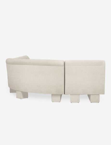 #color::Ivory-Boucle #configuration::right-facing #size::142-W | Rear view of the side of the Lena left-facing white boucle sectional sofa with upholstered beam legs.