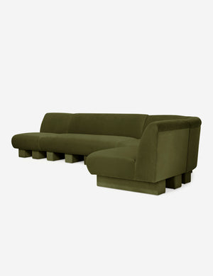 Angled view of the Lena right-facing gray velvet sectional sofa with upholstered beam legs.