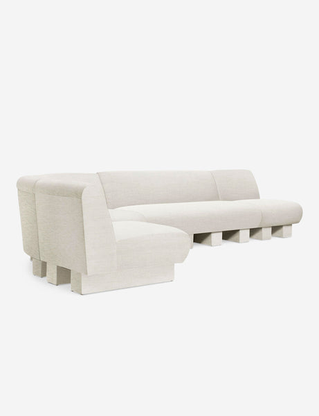#color::Natural-Linen #configuration::left-facing #size::142-W | Angled view of the Lena left-facing natural linen sectional sofa with upholstered beam legs.
