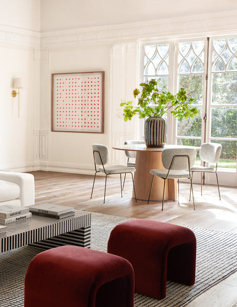 #color::cherry-and-white #size::48--x-48- | The See Through cherry red and white wall art hangs on a white wall in a room with a living area and breakfast nook