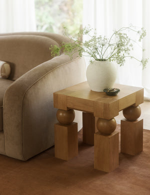 Living room featuring the Kent sculptural modern square side table.