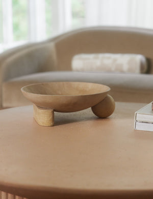 Kester sculptural footed decorative bowl styled on a coffee table.