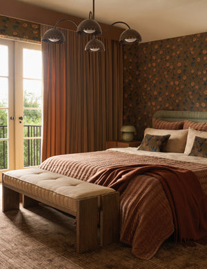 A bedroom featuring the Danka high-contrast motif hand-loomed viscose-jute blend rug.
