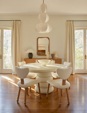 Luneth stacked lantern shade pendant light by Aimee Song hanging over a table in a dining room