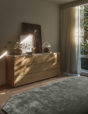 Bedroom featuring the Rayner carved linear detailing oak six drawer dresser.
