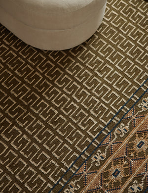 Close up of the Manca traditional geometric motif hand-knotted wool rug.