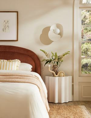 Lune half-moon, scalloped concrete side table styled as a nightstand
