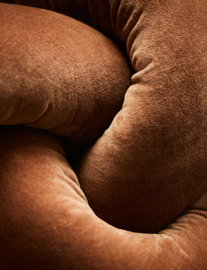 Close up of the Dewey velvet knot ball pillow.
