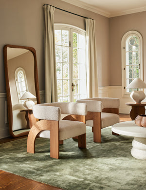 Living room seating area featuring the Agacia barrel back boucle upholstered accent chair by Aimee Song