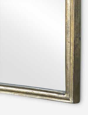 Close up of the frame of the Coudray serpentine gold leaf frame floor mirror