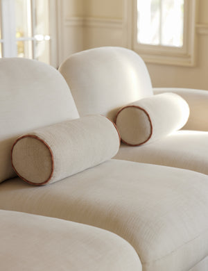 Merilee contrast piping striped bolster pillow by Aimee Song styled on a sofa
