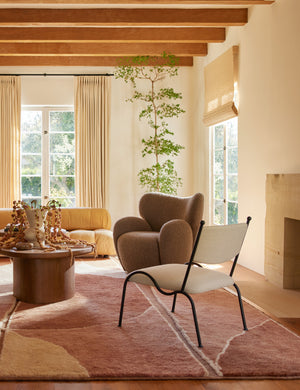 Fidia curved metal silhouette accent chair by Aimee Song