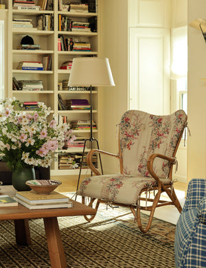 Francis slim frame tripod floor lamp by Heidi Caillier styled next to an accent chair