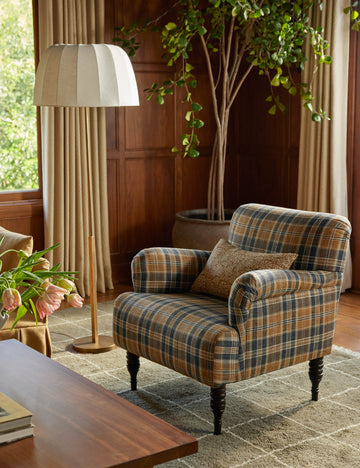 #color::brass | Ebele slim frame, linen shade floor lamp styled next to a plaid accent chair